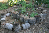 Our Front Yard medicinal herb garden made from recycled tree stumps. Have a garden like this installed in your home: http://gardens.thegrowinghome.net