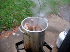 Once the bird is in the hot oil, turn the burner back on and adjust the heat. You want the oil to stay at 350.