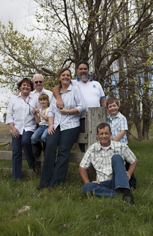 family on fence