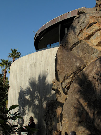 Curved walls, a looming boulder, and me in the shadows