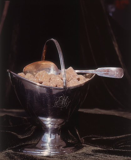 This beautiful silver sugar dish has a beautiful engraving of initials.