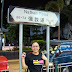 Leah posing by Nathan Road in Hong Kong