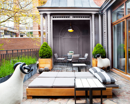 The sheep sculptures are a whimical touch when placed on a urban patio. (Gunn Landscape Architecture, PLLC in collaboration with Robert Stilin)