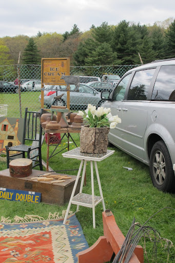The wood planter was sprouting white tulips. That's how to make a sale.