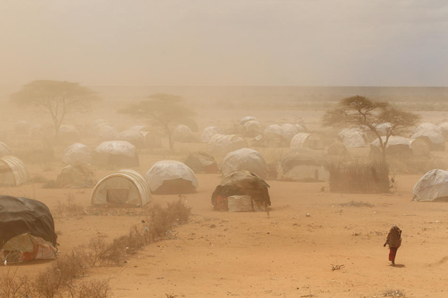 A dust storm blows as newly arrived Somalian refugees settle on the edge of the Dagahaley refugee camp, which makes up part of the giant Dadaab refugee settlement on July 23, 2011 in Dadaab, Kenya. The ongoing civil war in Somalia and the worst drought to affect the Horn of Africa in six decades has resulted in an estimated 12 million people whose lives are threatened. Oli Scarff / Getty Images