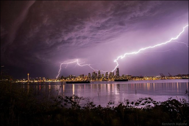 Lightning over Seattle on 10 August 2013. It's the warm and muggy nights that have not only brought a few nights of thunderstorms to the area but also primed Seattle to shatter its record for warmest August nights. Photo: Kenneth Malone