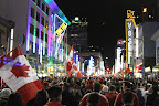 Crowds celebrating the last night of the Olympics on Granville Street