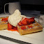 Waffles with strawberries and banana whipped cream for breakfast