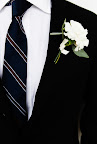 The groom wore Daniel Cremieux for Dillard's, and the boutonniere was created by contributing editor Matthew Robbins.