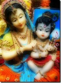 [Mother Yashoda holding Krishna]