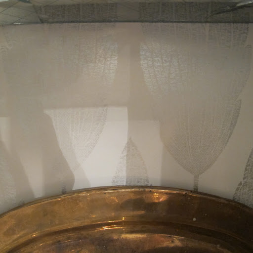The wall paper is so subtle, yet gives the bar shelves such a custom look.