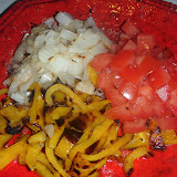 The grilled, diced-up peppers, onion, and tomatoes.
