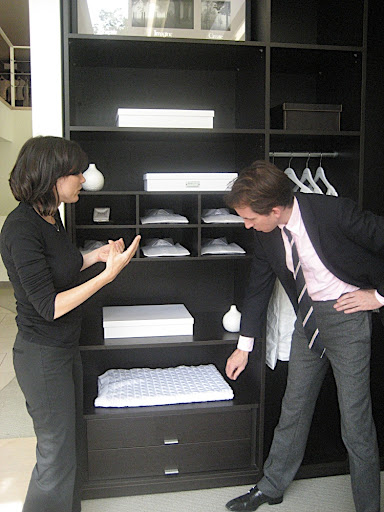 She explains the closet system and storage options.