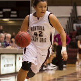 Shanae Gilham, a freshman forward from Bozeman, Mont., drives towards the rim without hesitation as the clock winds down on Montana's 2012-13 season opener. Gilham's nine points and two rebounds helped the Lady Griz beat the Carroll College Knights 72-45.
Dahlberg Arena in Missoula, Mont., October 30th, 2012.