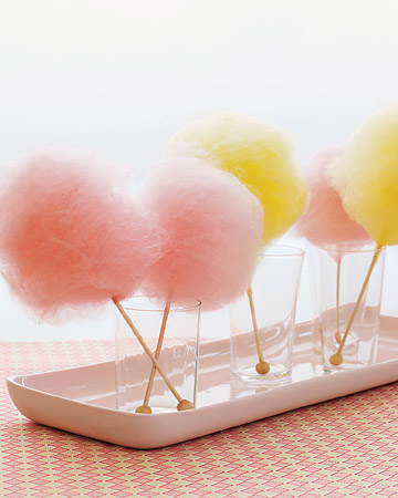 Another non-floral centerpiece idea? Frothy cotton candy spun onto rock candy sticks. Instant color and a sweet take-home favor. (marthastewartweddings.com)