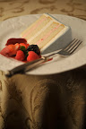 Take a look at the inside of the confection: ThisTahitian vanilla cake, with alternating layers of strawberry mousseline and French vanilla, is finished off with meringue buttercream and gray Swiss fondant.