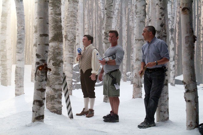 Nathan Lane, cools himself with a small fan on a not-so-cold snow set, waiting with make up artist Charles Carter and Denis Hamel, the gentleman whose job function is titled "key prop on set," "Snow White," September 13, 2011