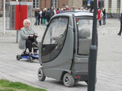 Kristiansand, Norway - Check out this guys wheelchair - it's the luxary liner...and he was flirting with this woman and showing off his "sports car"