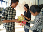 Nick, Julie, and Kate work on the bride's bouquet. See the fringed tie?