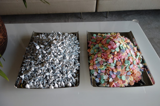 I kept my version of a candy buffet very simple. Silver trays were piled high with Hershey's kisses and candy hearts. The bulk candy came from www.acandystore.com