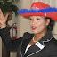 Shawn Bailey (flag for the day) singing God Bless America at the September 2010 Membership Tea.