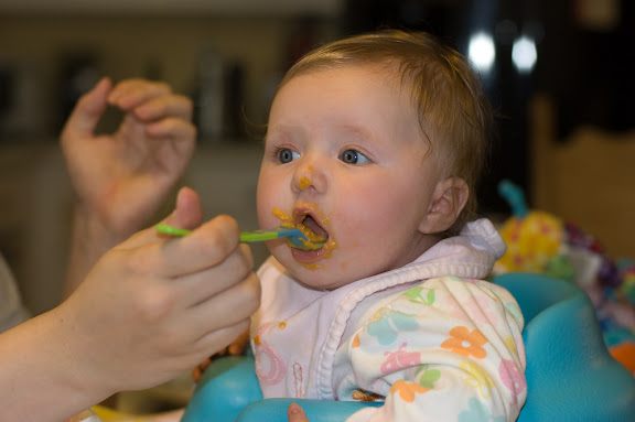 We've started feeding her sweet potatos, which she enjoys a LOT more than the rice cereal.