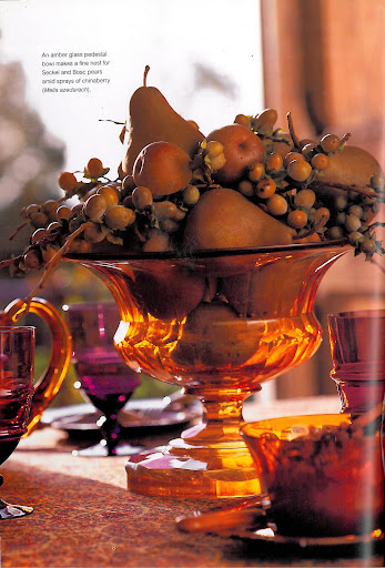 The golden glass of this pedestal looks gorgeous in the sunlight and works well with the fuchsia goblets in the background. Filled with pears and chinaberries, it is a stunning centerpiece for Thanksgiving - made even better by the fact that it is half-edible (do not eat the chinaberries!) The golden glass of this pedestal looks gorgeous in the sunlight and works well with the fuchsia goblets in the background. Filled with pears and chinaberries, it is a stunning centerpiece for Thanksgiving - made even better by the fact that it is half-edible (do not eat the chinaberries!)