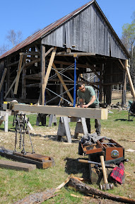 Michael carefully lays out a freshly hewn post.