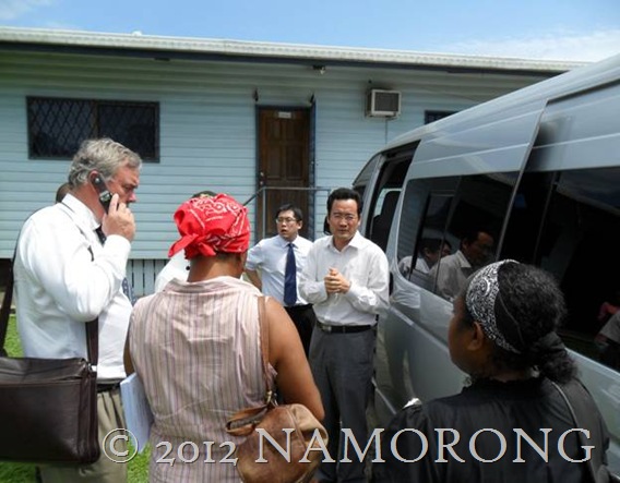 Chinese Miners (MCC) and their lawyer face the Press outside the National Court in Madang