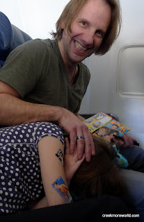 If you fall asleep next to daddy on the airplane , he will cover you with Justin Beiber stickers from your J-14 magazine.