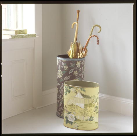 Dress up plain wastebaskets and umbrella stands with a covering of wallpaper. (marthastewart.com) Dress up plain wastebaskets and umbrella stands with a covering of wallpaper. (marthastewart.com)