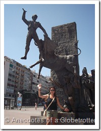 Posing in Front of a Bullfighter Statue