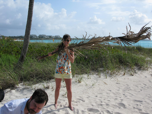 Here's Erin holding up a palm tree branch. We had to create some tropical shadows to make the shot just perfect.