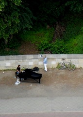 Really pretty music. Apparently grand pianos are street instruments now.
