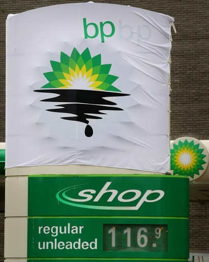 A BP gas station sign that has been hacked by activists, 27 July 2010. Peter Macdiarmid / Getty Images