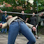 The eventual winner of the limbo... could happily walk along the street with her head leaning on her ankles and show no sign of discomfort!