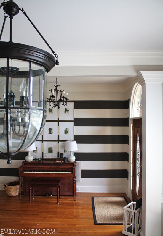 large lantern pendant and chandelier in foyer