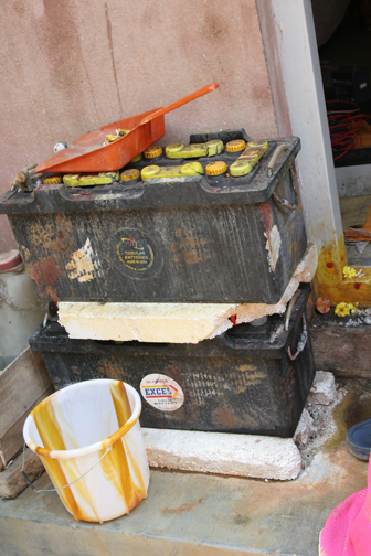 I thought this was a creative set up: Jayashree’s neighbor makes a living charging batteries.