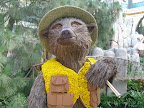 A bear wearing a floral vest at the Bellagio Conservatory and Botanical Garden.