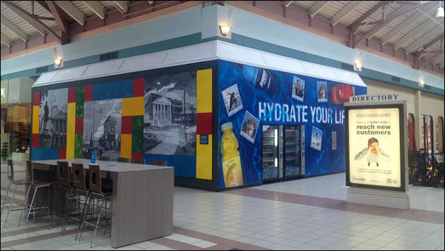 The Steeplegate Mall in Concord, New Hampshire has a rash of vacancies. One of the ways it dresses up empty spaces is to cover them with advertising and vending machines. Photog: Matt Townsend / Bloomberg