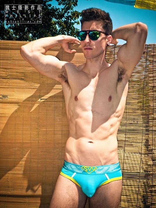 sexy guy in blue briefs by West Phillips Photography
