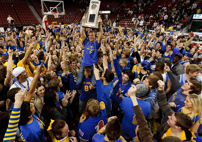 Orem student Nate Mella held the state championship trophy aloft as Orem fans swarmed the court following their team's state championship win over Olympus. Orem vs. Olympus, 4A high school state championship game Saturday, March 3, 2012 at the Maverik Center in West Valley City, Utah. Orem student Nate Mella held the state championship trophy aloft as Orem fans swarmed the court following their team's state championship win over Olympus. Orem vs. Olympus, 4A high school state championship game Saturday, March 3, 2012 at the Maverik Center in West Valley City, Utah.