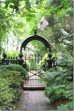 secret garden, gate, herringbone brick, arch, wrought iron