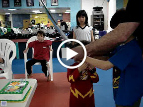 Video - cutting Kai's birthday cake with a sword