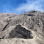 Gill climbing up the rocky slope to Raung crater rim