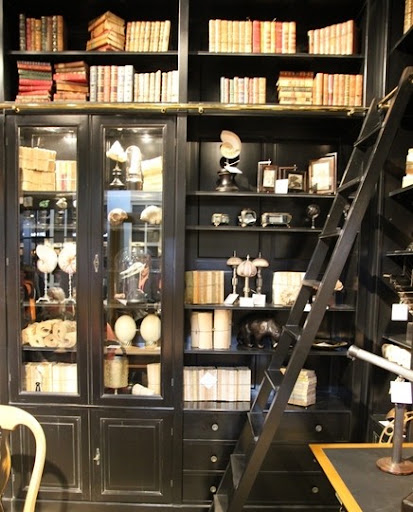 My favorite part of this rolling ladder is the brass metal fixtures. (Pinterest)
