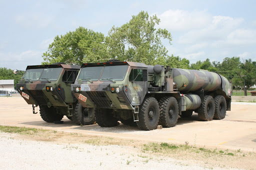 Army National Guard vehicles stationed outside the National Guard Armory.