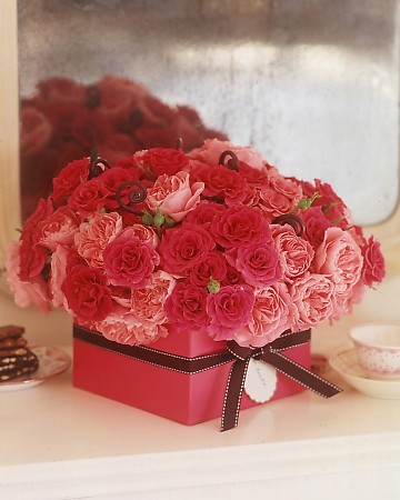 Roses in a ribbon box make a beautiful hostess gift.