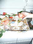 Naomi used a classic trick to form this centerpiece. Scotch tape grids to give you more control over where each flower goes.