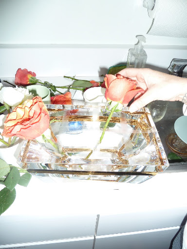 Naomi used a classic trick to form this centerpiece. Scotch tape grids to give you more control over where each flower goes.